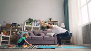 a woman and a child playing in a living room